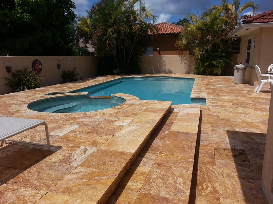 An earthy, marble swimming pool deck renovation